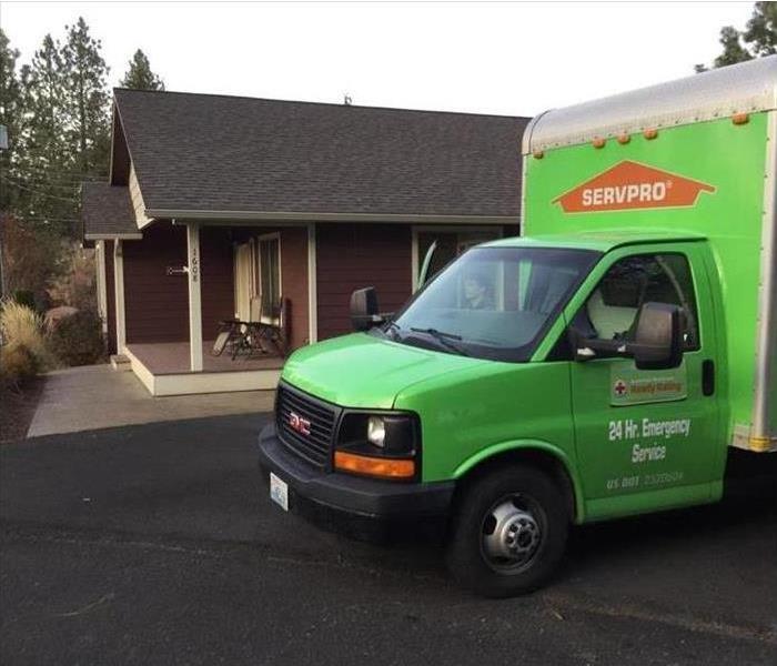 SERVPRO vehicle in front of a customer's houseq